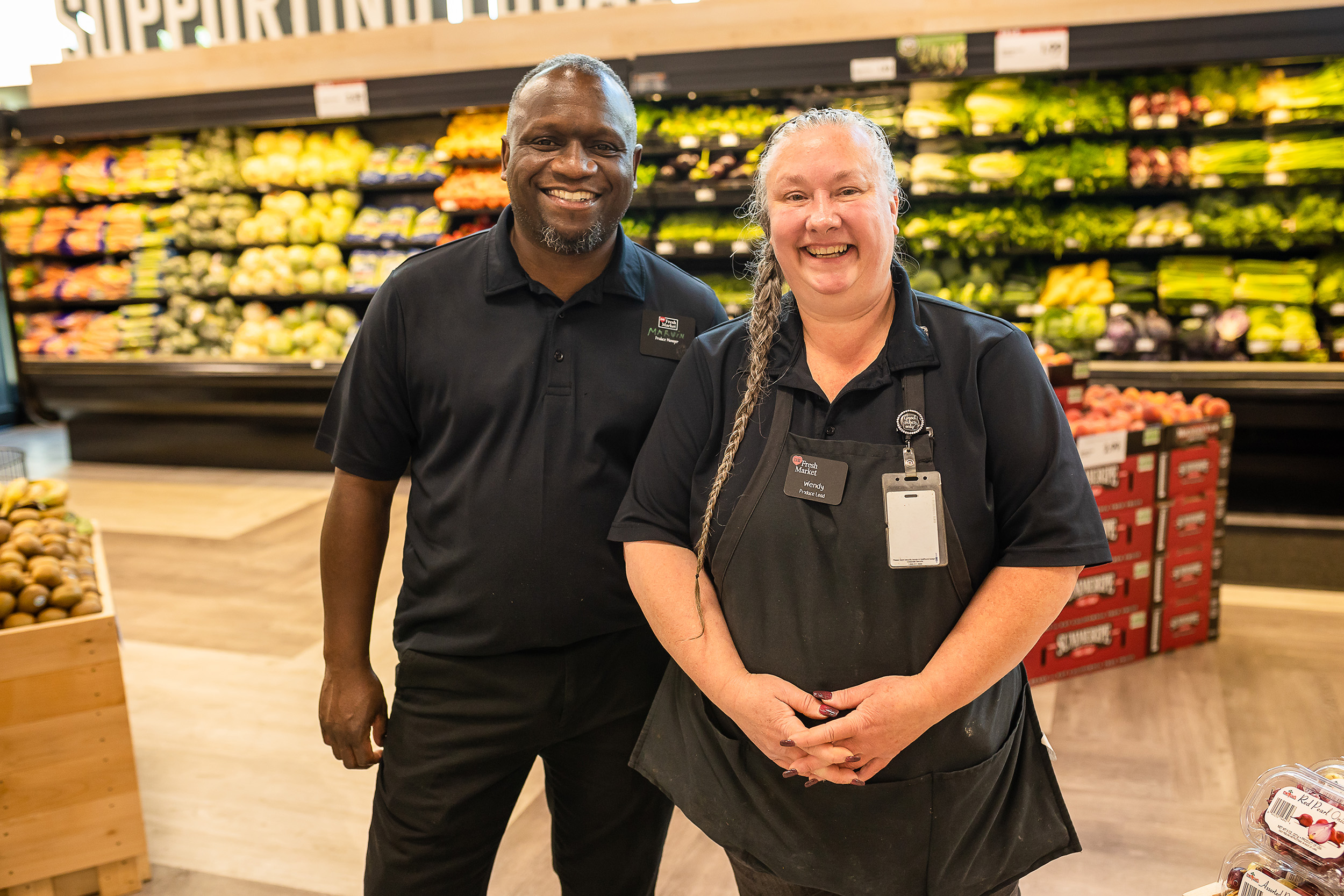 a man and woman standing in a D&W grocery store