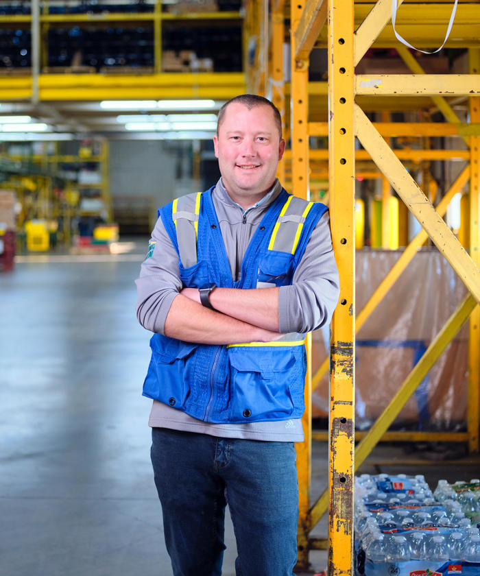 a man standing in a warehouse