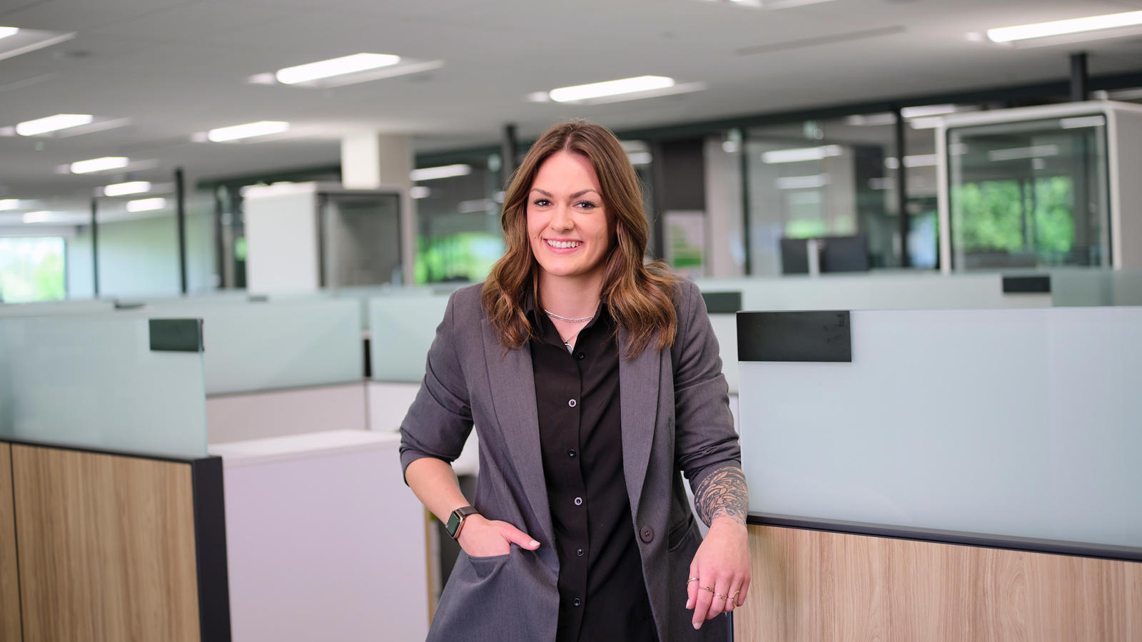 a woman standing in an office