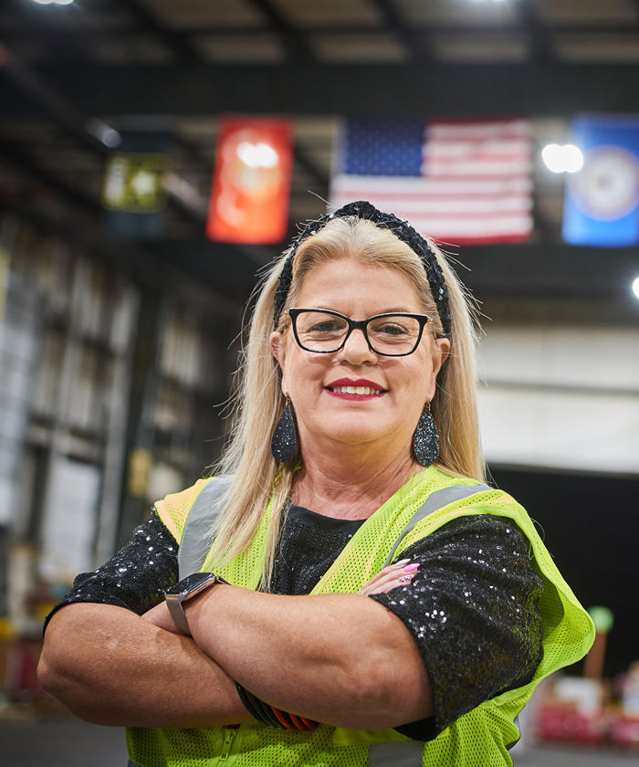 a woman in a yellow vest