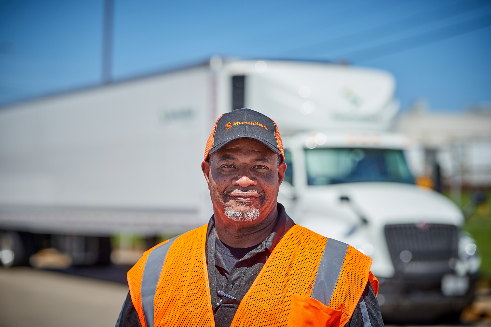 a man at the Omaha distribution center in a vest and hat