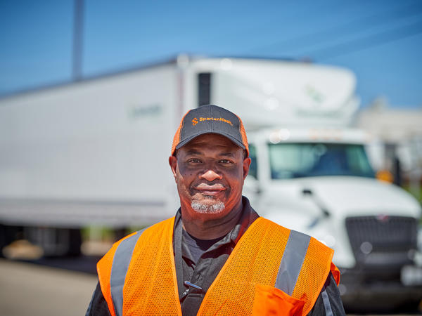 a man at the Omaha distribution center in a vest and hat