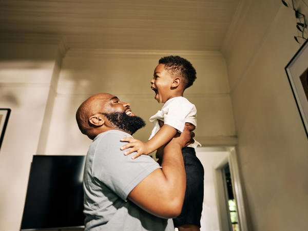 a man holding a child
